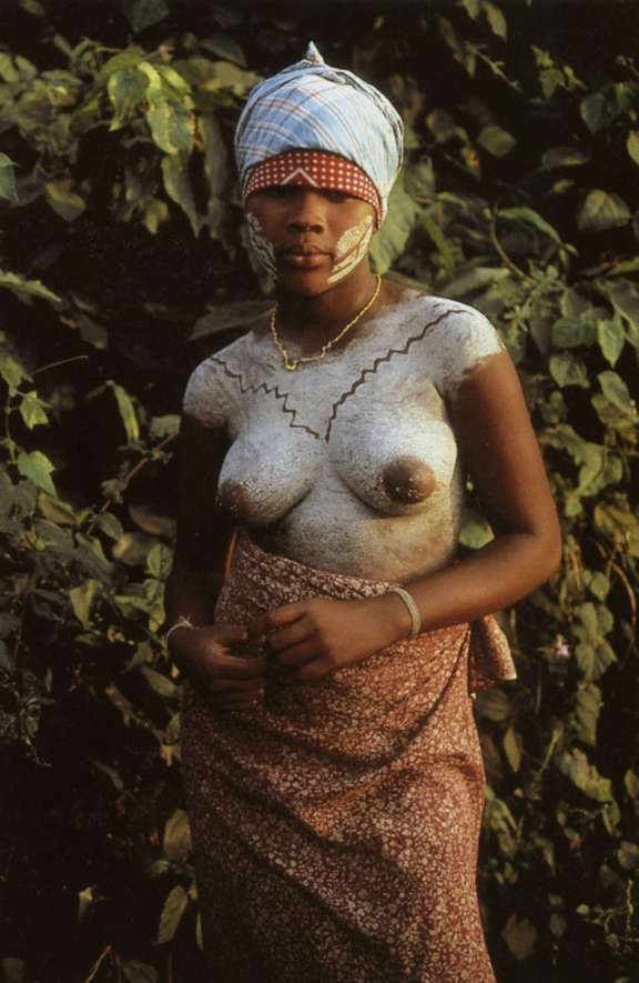 Young Bassa woman from River Cess covered in kaolin paint. © Charles D. Miller III
