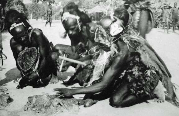 Initiates wearing masks during a ritual sequence, circa 1925-1954. © Daniel P. Biebuyck